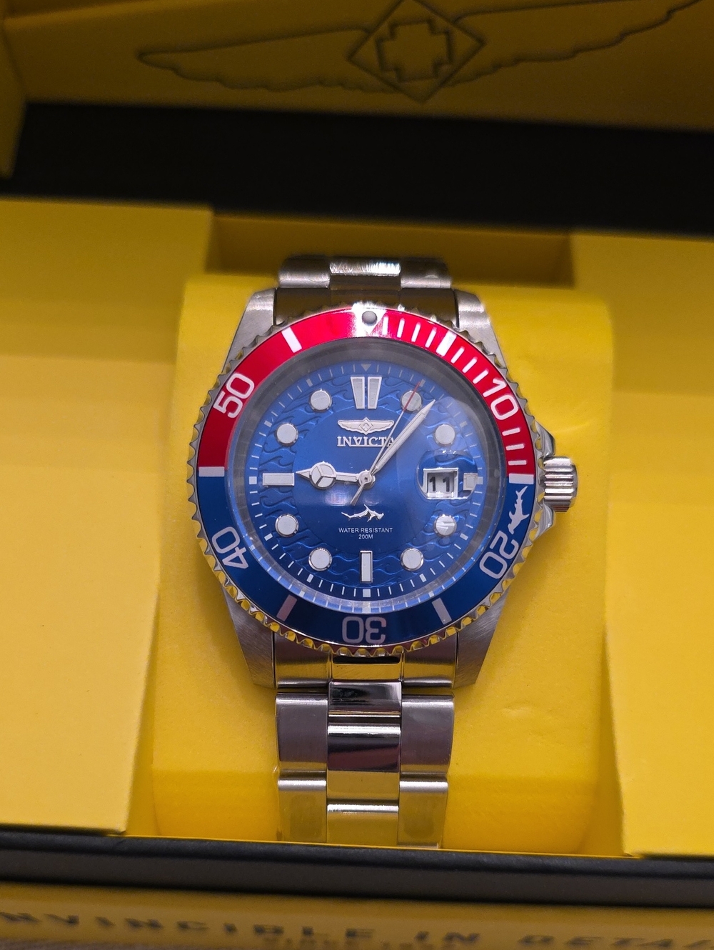 192. Invicta Stainless Steel Dive Watch with Blue Dial and Red-Blue Bezel